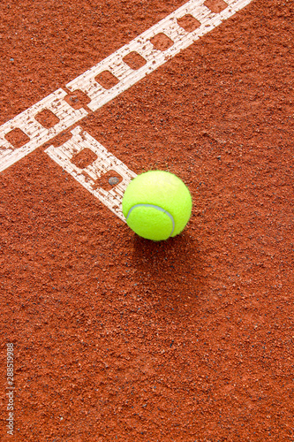 One tennis ball on tennis court with a line © Friedemann Blümel
