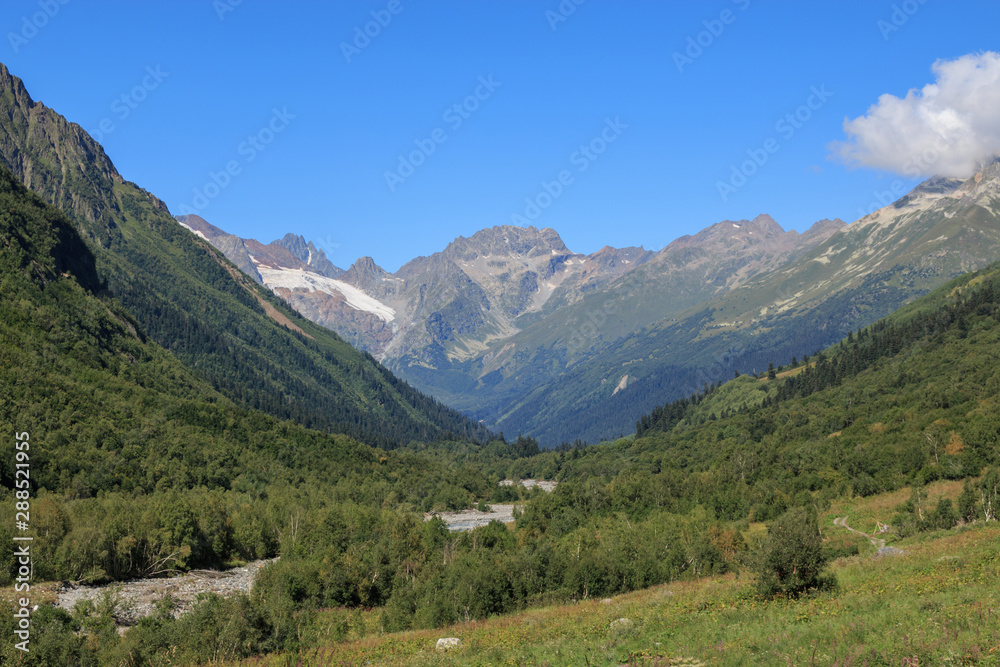 Closeup view mountains and river scenes in national park Dombay, Caucasus