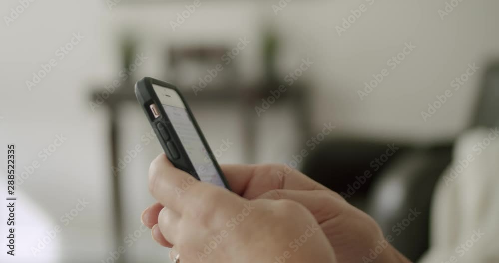 Woman on Phone Hands Typing, Texting, Emailing, in Bright Room Woman on Phone Hands Typing, Texting, Emailing, in Bright Room