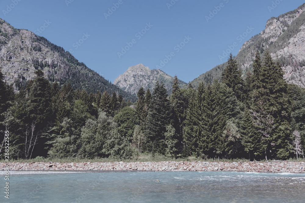 Panorama view of river scene in mountains of national park Dombay, Caucasus