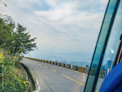 Beautiful view on the bus on tongtian road moving from tianmen mountain heaven gate cave on tianmen mountain national park at zhangjiajie city China.Tongtian Road the winding Road  99  curves road photo