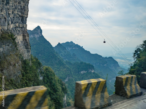 Beautiful view on the bus on tongtian road moving from tianmen mountain heaven gate cave on tianmen mountain national park at zhangjiajie city China.Tongtian Road the winding Road  99  curves road photo