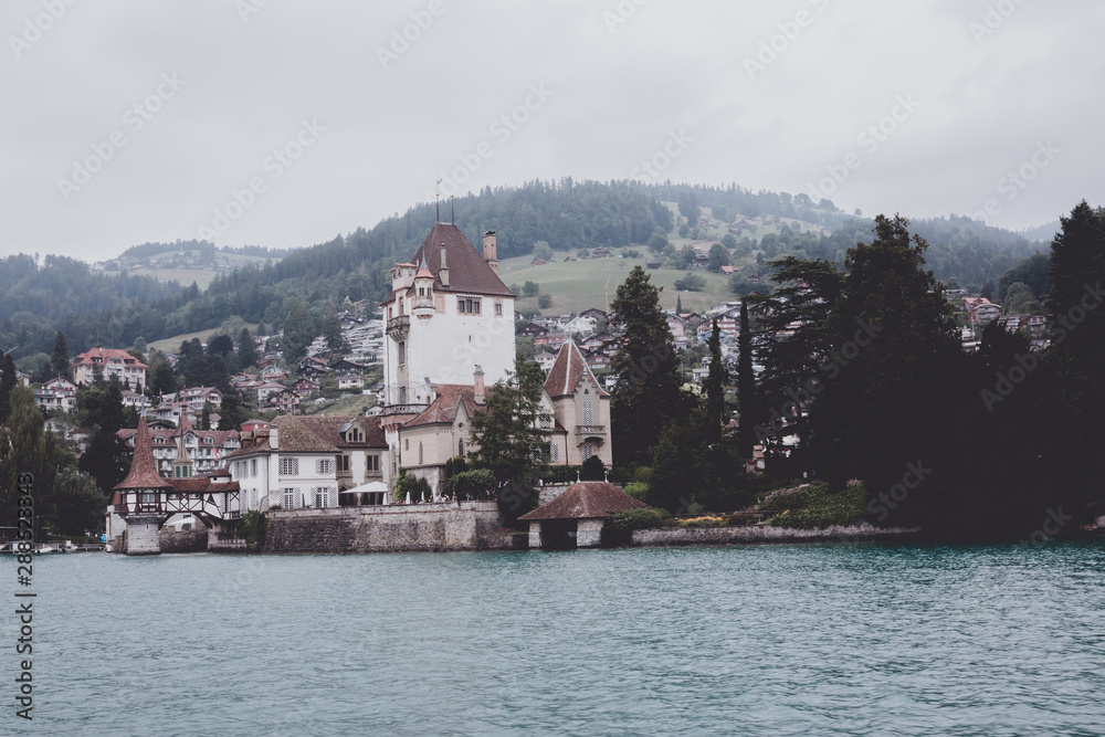View on lake Thun and mountains from ship in city Spiez, Switzerland