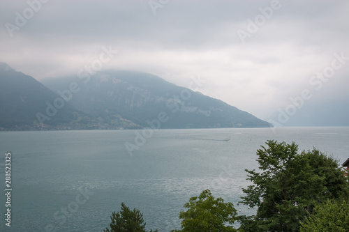 View on lake Thun and mountains from ship in city Spiez, Switzerland © TravelFlow
