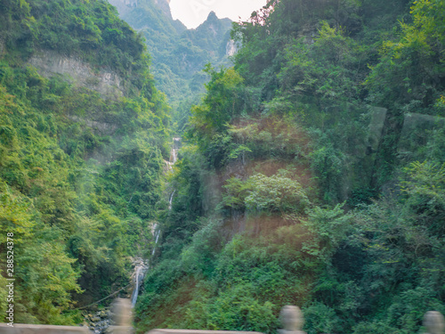 Beautiful view on the bus on tongtian road moving from tianmen mountain heaven gate cave on tianmen mountain national park at zhangjiajie city China.Tongtian Road the winding Road  99  curves road photo
