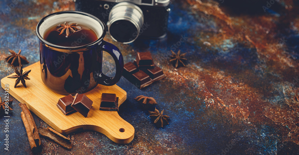 Hot winter tea with cinnamon stick and chocolate Hot winter tea with cinnamon stick and chocolate