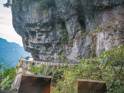 Beautiful view on the bus on tongtian road moving from tianmen mountain heaven gate cave on tianmen mountain national park at zhangjiajie city China.Tongtian Road the winding Road  99  curves road photo