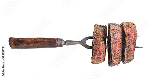 Fork with three beef slices isolated on white