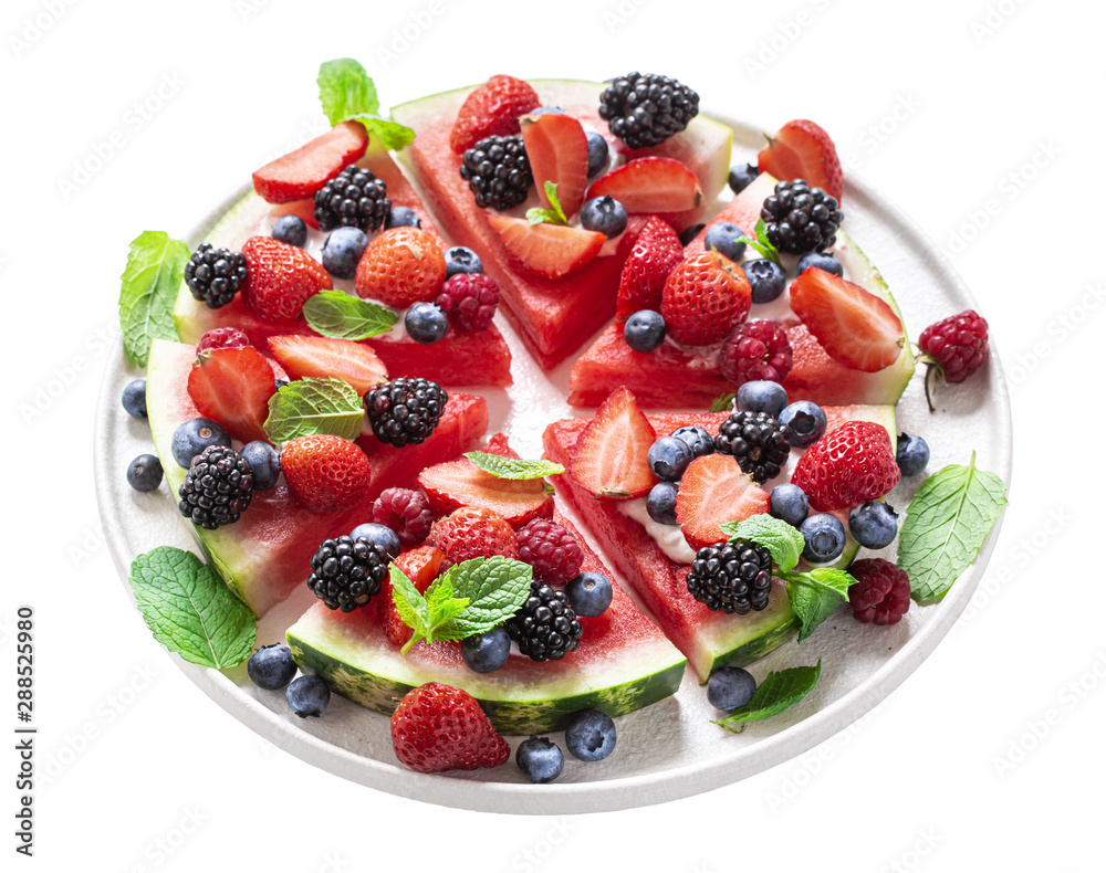Watermelon pizza in slices with berries and mint isolated on white Watermelon pizza in slices with berries and mint isolated on white