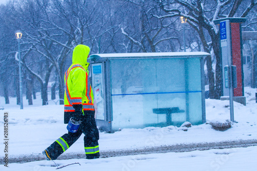 Canadian construction worker in winter walking in the snow