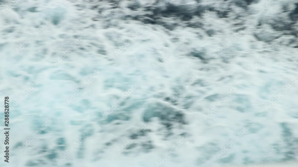 Wake of water left by a ship in the blue sea. Wake of water left by a ship in the blue sea. 