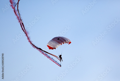 Parachute display team performs  during cricket festival at Isa Town, Bahrain photo