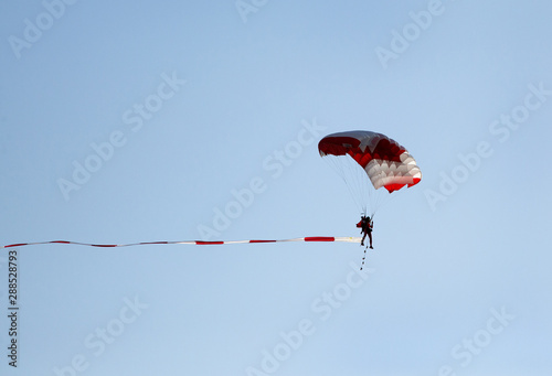 Parachute display team performs  during cricket festival at Isa Town, Bahrain photo