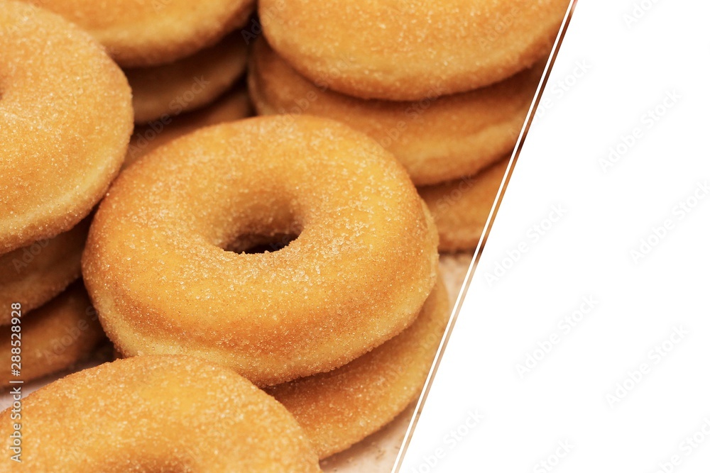 Round sugar donuts, cooked homemade, sweet dessert with sugar. Donuts background, copy space, place for text.