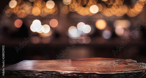 Canvas Print Wood texture table top (counter bar) with blur light gold bokeh in cafe,restaura