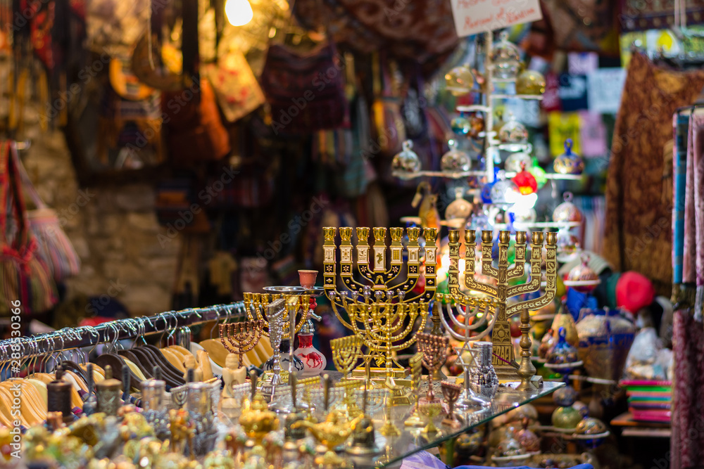 Market or Bazzar in Old City of Jerusalem. Traditional products and souvenirs in antique shop. Israel.