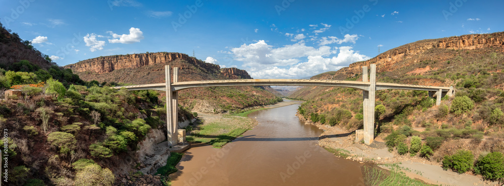 Fototapeta premium View to the valley with new bridge across mountain river Blue Nile near Bahir Dar, Ethiopia.