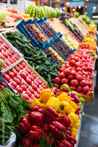 Vegetable farmer market counter: colorful various fresh organic healthy vegetables at grocery store. Healthy natural food concept