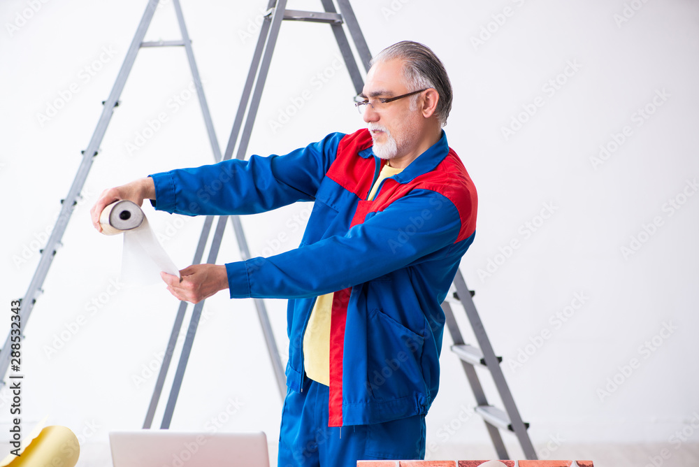 Old contractor doing renovation at home Old contractor doing renovation at home