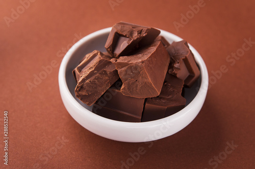 Pieces of chocolate in a white bowl