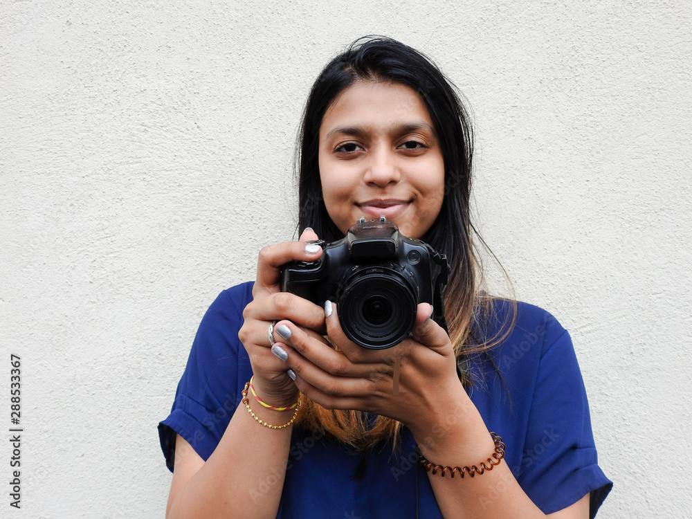 Woman Holding And Pointing The Camera Straight Ahead Woman Holding And Pointing The Camera Straight Ahead