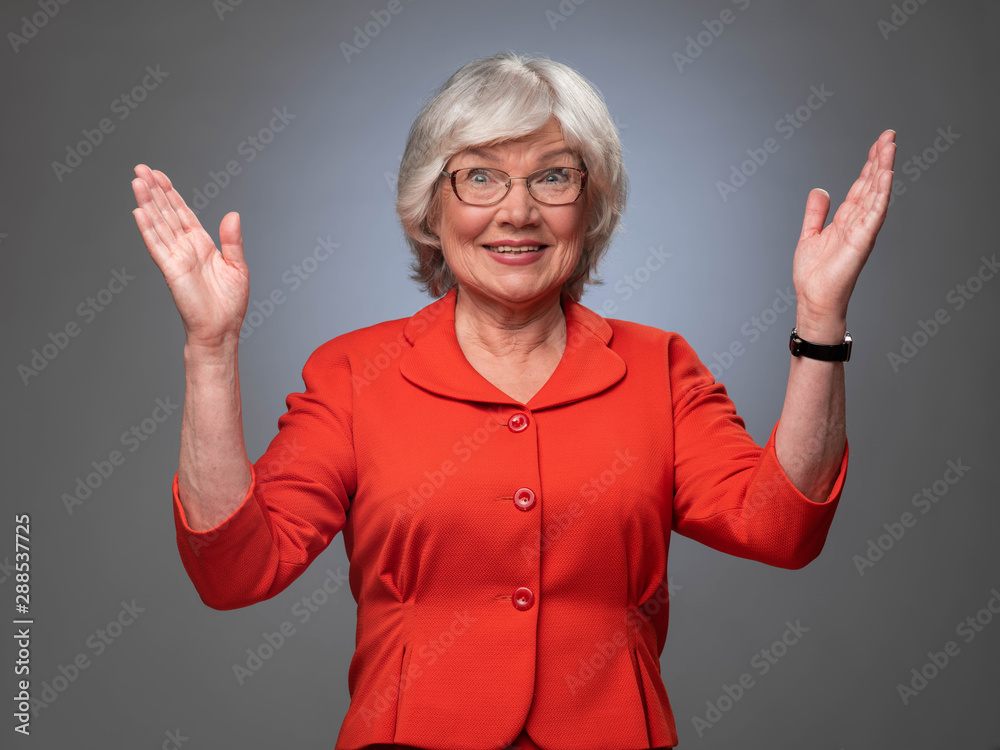 Happy senior lady with hands up Happy senior lady with hands up