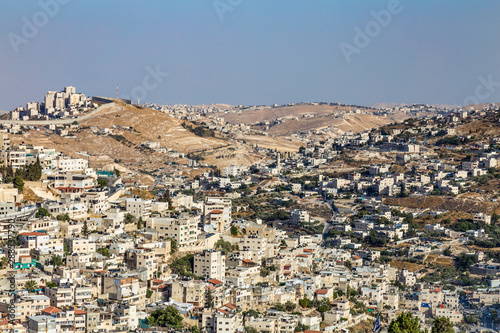 Konstfotografi Small village and the Israeli West Bank barrier or wall - separation barrier on the West Bank in Israel