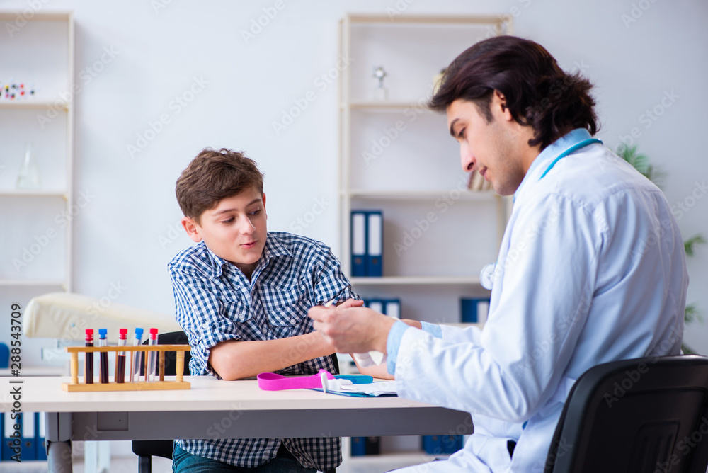 Obraz premium Boy in blood tranfusion concept