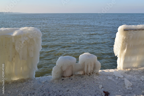 Iced knecht and fence on the wharf in Zelenohrad. Kaliningrad region photo