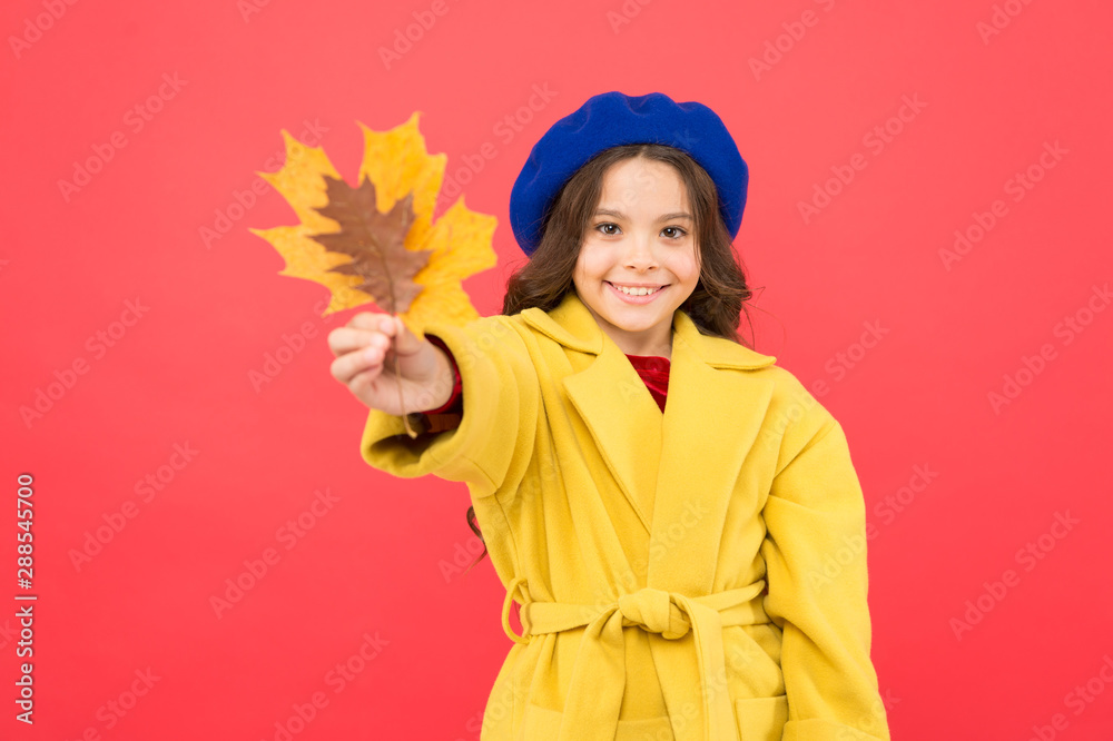 Trendy beauty. school time. childhood happiness. fall season. fallen leaves bunch. parisian girl child in french beret and yellow coat. happy little girl with maple leaf. autumn kid fashion Trendy beauty. school time. childhood happiness. fall season. fallen leaves bunch. parisian girl child in french beret and yellow coat. happy little girl with maple leaf. autumn kid fashion