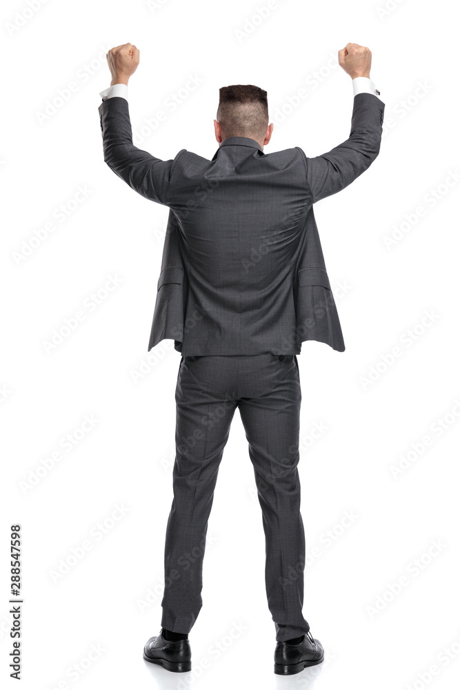 happy businessman with his hands in the air celebrating success happy businessman with his hands in the air celebrating success