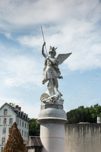 Archangel Michael fighting a dragon set on the square in the sanctuary of Lourdes
