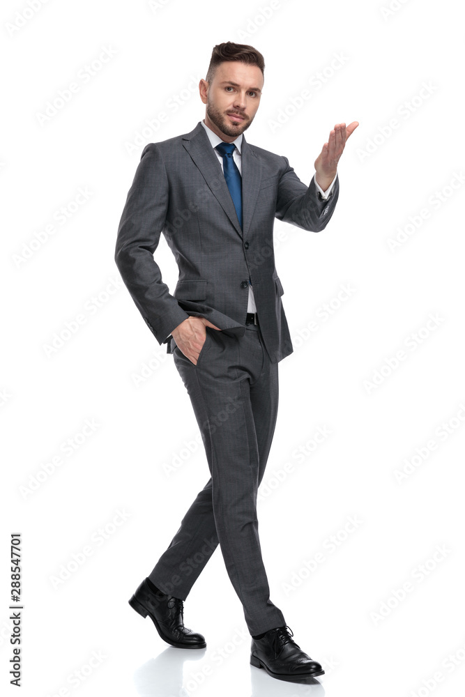 confident young businessman is pointing his hand confident young businessman is pointing his hand