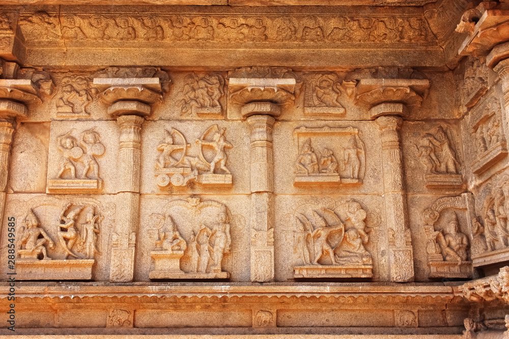 sculptures in the wall of ancient Hindu temple in the ruins in Hampi India