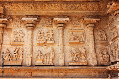 sculptures in the wall of ancient Hindu temple in the ruins in Hampi India