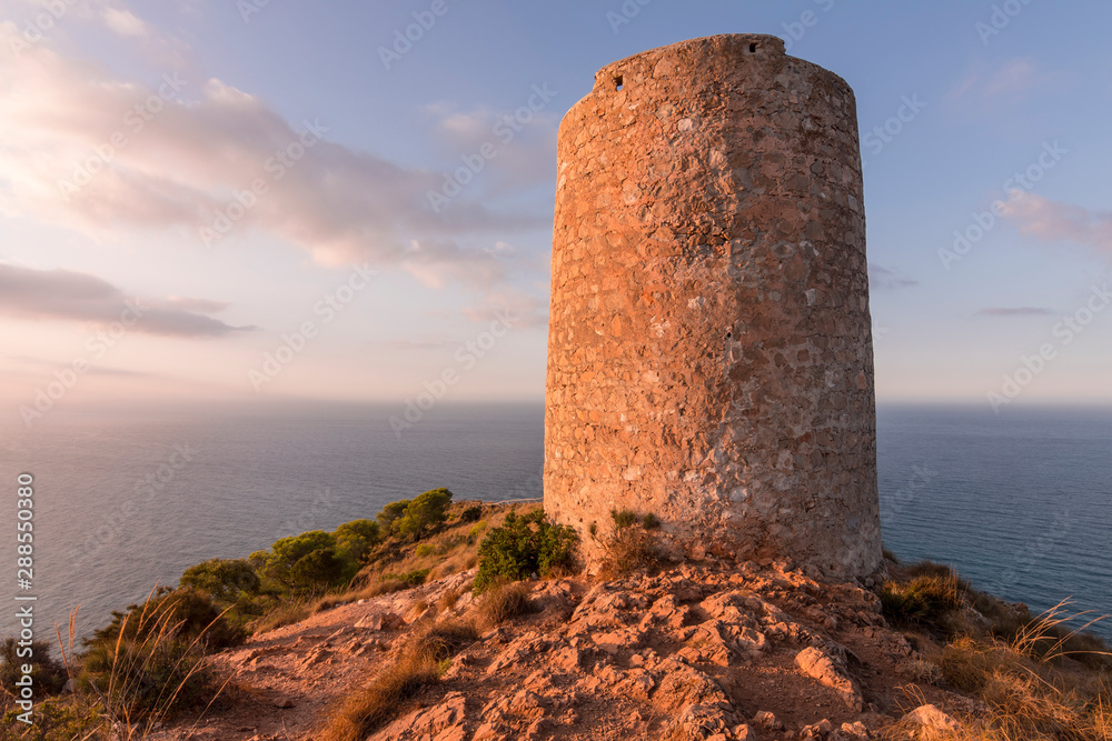 Cerro Gordo Watchtower at sunrise on the Costa Tropical of Granada (Spain)