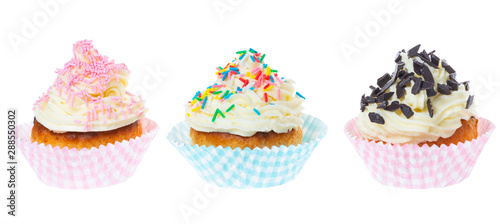three cupcakes with butter cream decorated sprinkles isolated on white background, panorama