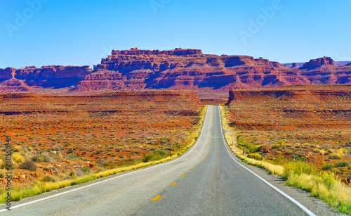 View of Monument Valley on a sunny day on the Highway 163 in Navajo Nation Reservation in USA.