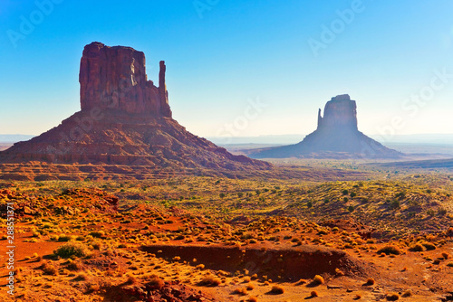 View of Monument Valley on a sunny day near the border of Arizona and Utah in Navajo Nation Reservation in USA.