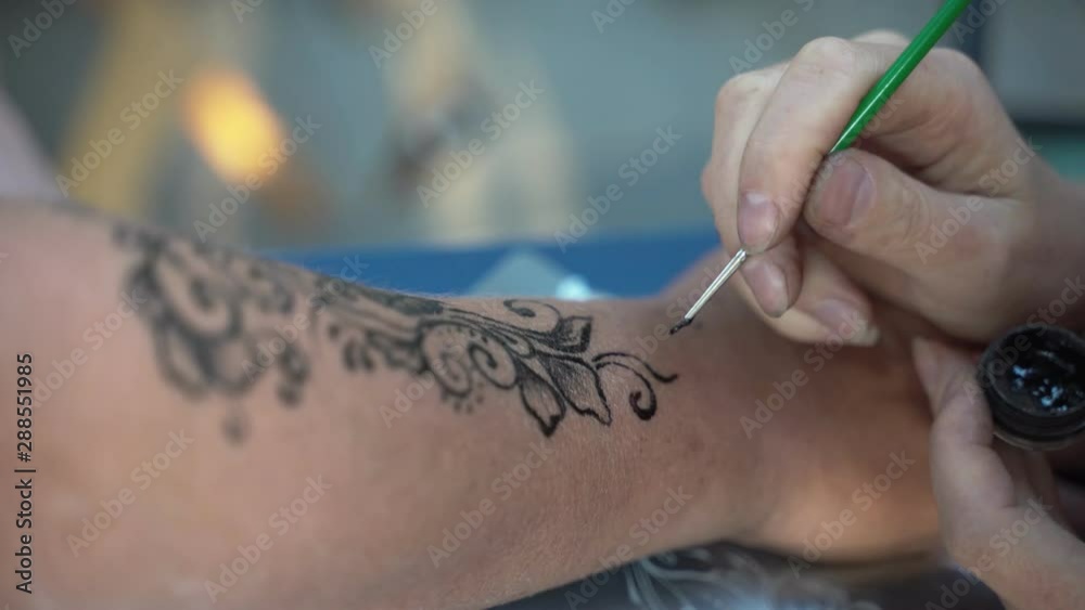 The girl on the forearm is made with Henna Tattoo. The girl on the forearm is made with Henna Tattoo.