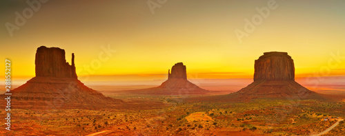 View of Monument Valley at sunrise near the border of Arizona and Utah in Navajo Nation Reservation in USA. photo