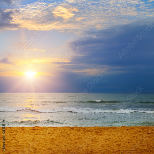 Beach of the ocean and sunrise. © alinamd