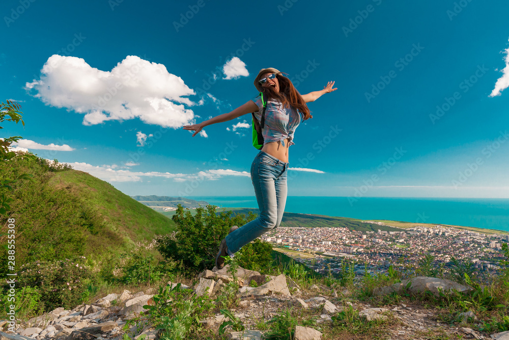 Fototapeta premium Woman jumping in view Black sea