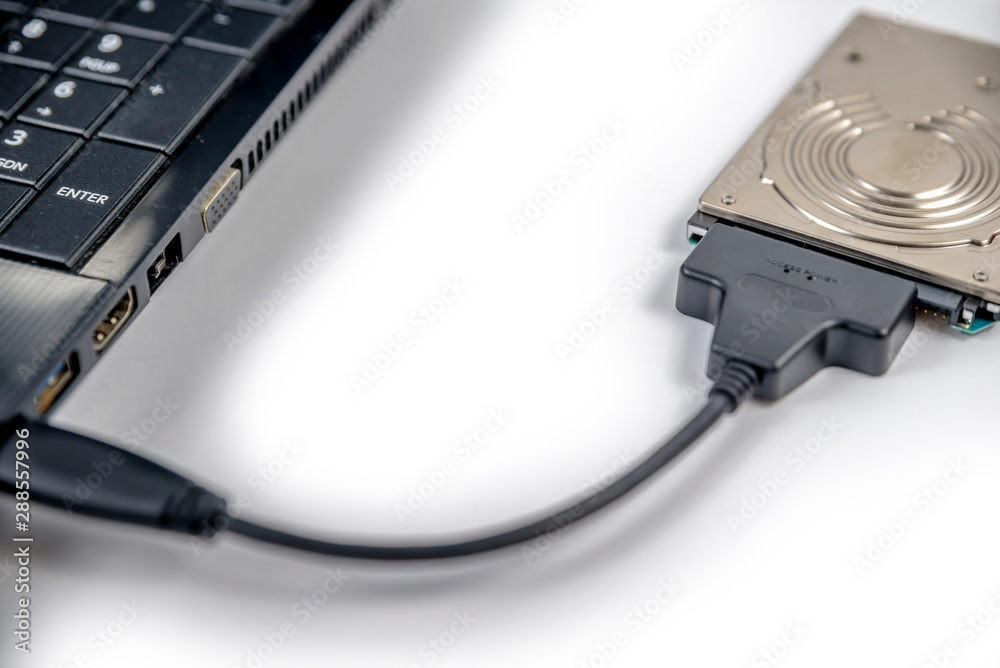 hdd 2.5 internal hard drive disk connected to laptop via sata usb cable closeup view hdd 2.5 internal hard drive disk connected to laptop via sata usb cable closeup view