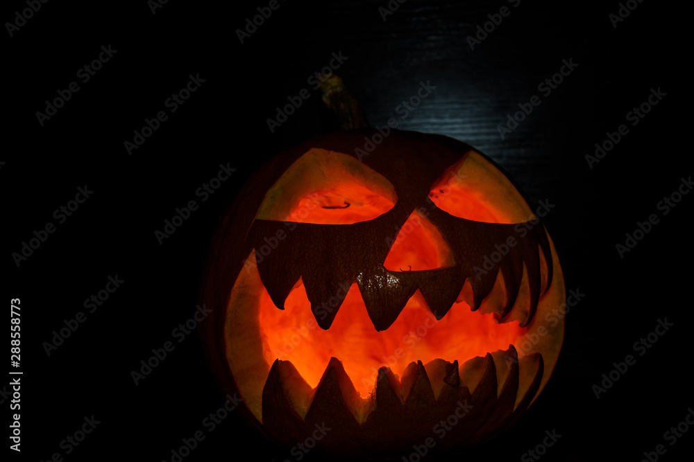Spooky halloween pumpkin on a black background Spooky halloween pumpkin on a black background