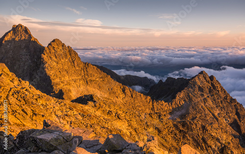 Fototapeta Naklejka Na Ścianę i Meble -  Mountains Landscape with Inversion in the Valley at Sunset as seen From Rysy Peak in High Tatras, Slovakia