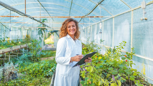 Researcher botanical research wearing a white coat. photo