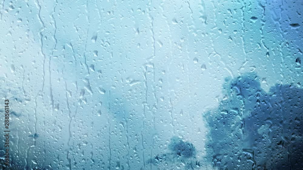 Storm clouds time lapse with rainy wet window. Bad weather background.
