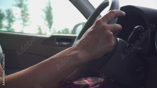 Closeup Of Woman Hands On Steering Wheel