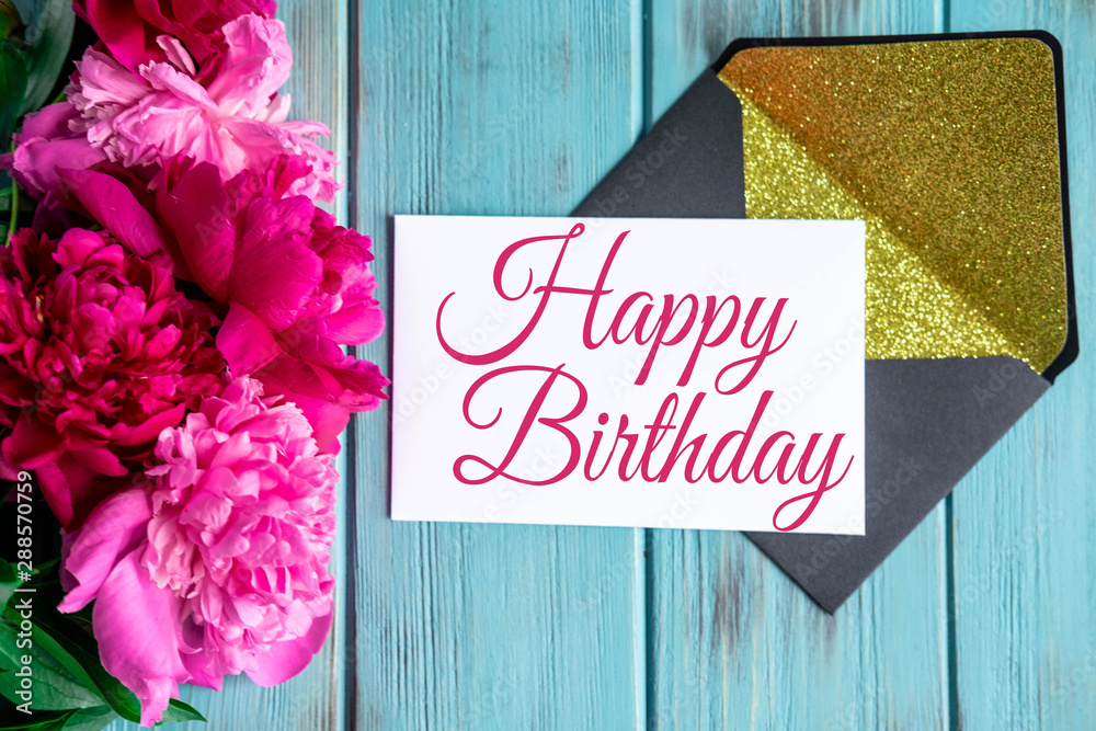 Happy birthday lettering with peony flowers and a card on a blue wooden  background. Greeting card for the birthday of mom, daughter, girl. View  from above Stock Photo | Adobe Stock